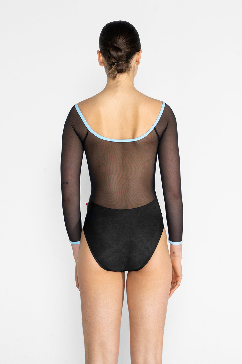 Nina leotard in N-Black body color with Mesh Black top color and T-Pool trim color