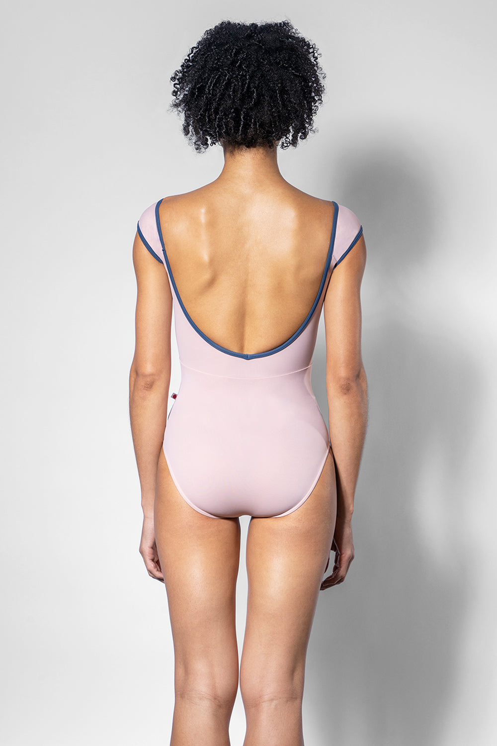 Elli leotard in T-Petal body and top color with T-Storm trim color