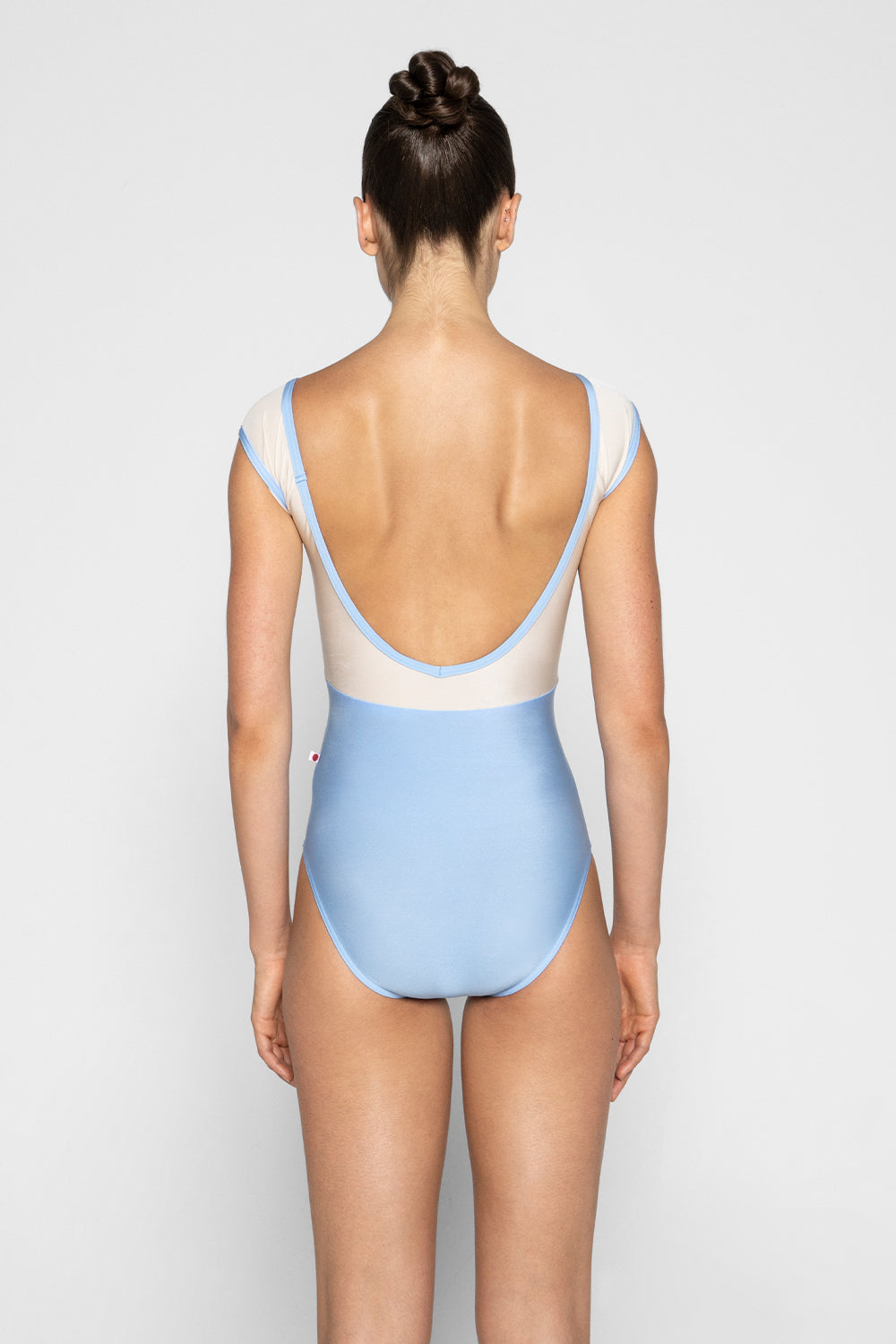 Elli leotard in N-Moontide body & trim color with N-Pearl top & cap sleeve color