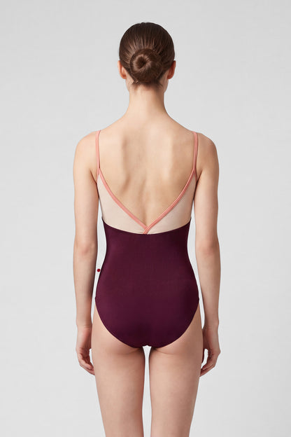 AI-generated model. Daria leotard, blush mesh V-neck upper and a deep-burgundy body with thin blush straps.