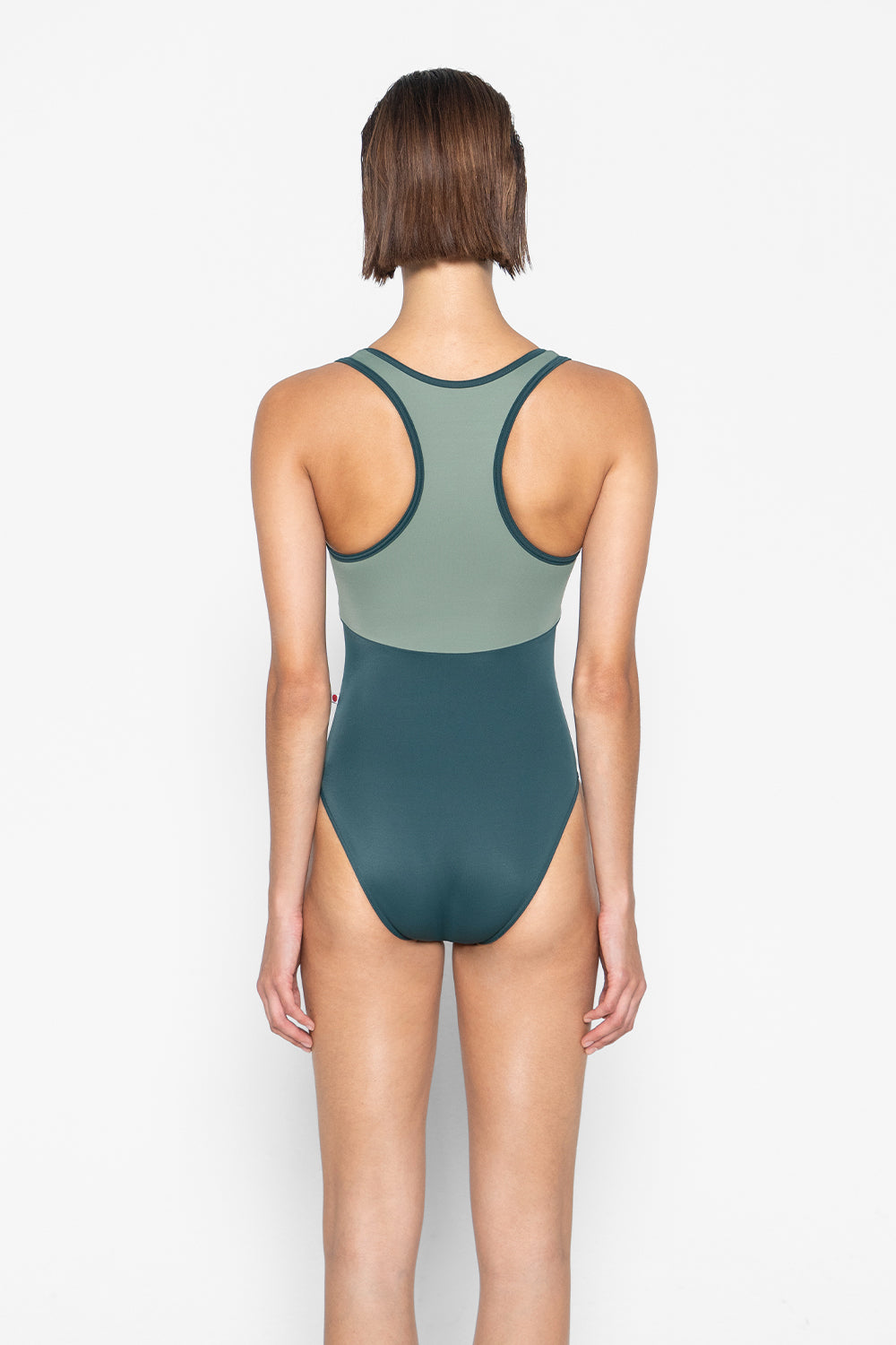 Laura Duo leotard in T-Kale body & trim color with T-Sage top color