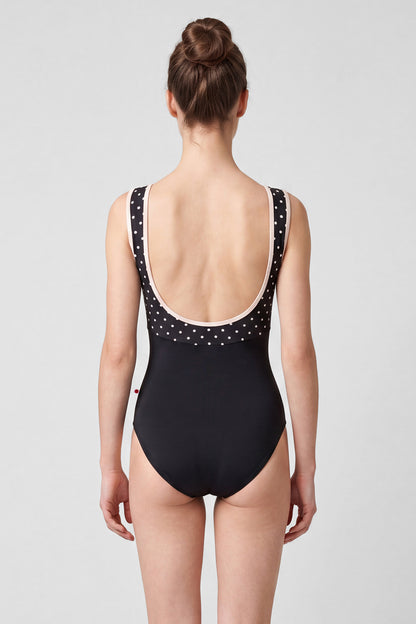 AI-generated model. Sofiane leotard, black T-Lunares polka-dot bodice and black body, high boat neckline with blush trim.