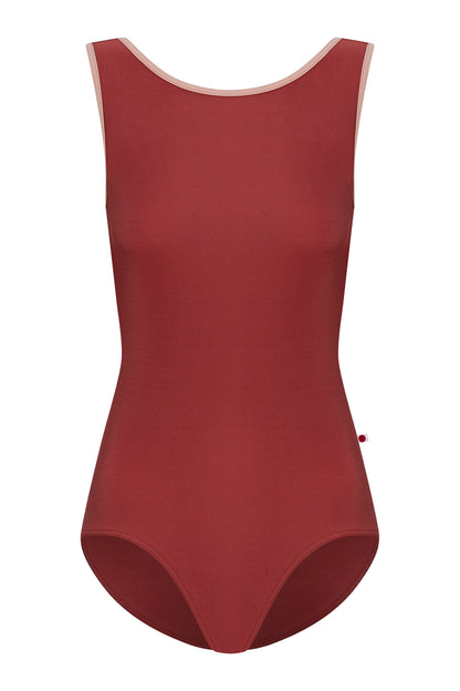 Sofiane leotard, brick-red with a high boat neckline and pink strap trim.
