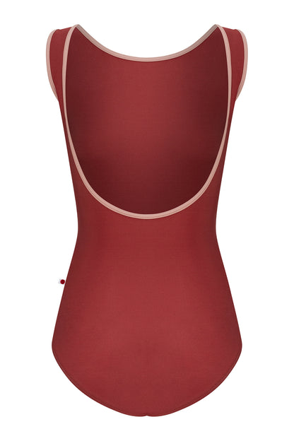 Sofiane leotard, brick-red with a high boat neckline and pink strap trim.