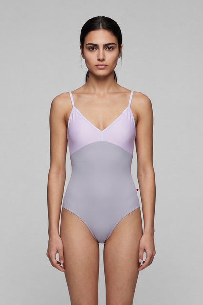 AI-generated model. Daria leotard, lilac bodice and a grey body with a V-neckline and thin straps.