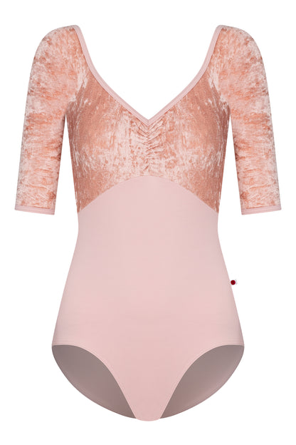 AI-generated model. Elli leotard, blush-pink with a crushed-velvet elbow-sleeve bodice and gathered V-neck.