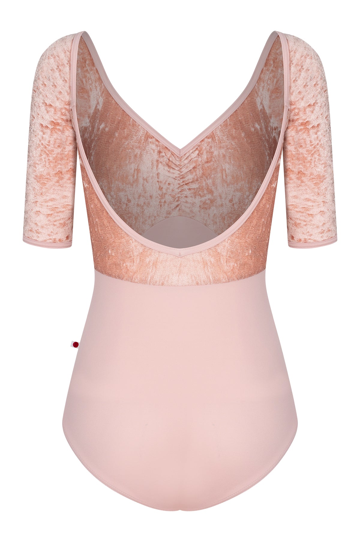 AI-generated model. Elli leotard, blush-pink with a crushed-velvet elbow-sleeve bodice and gathered V-neck.