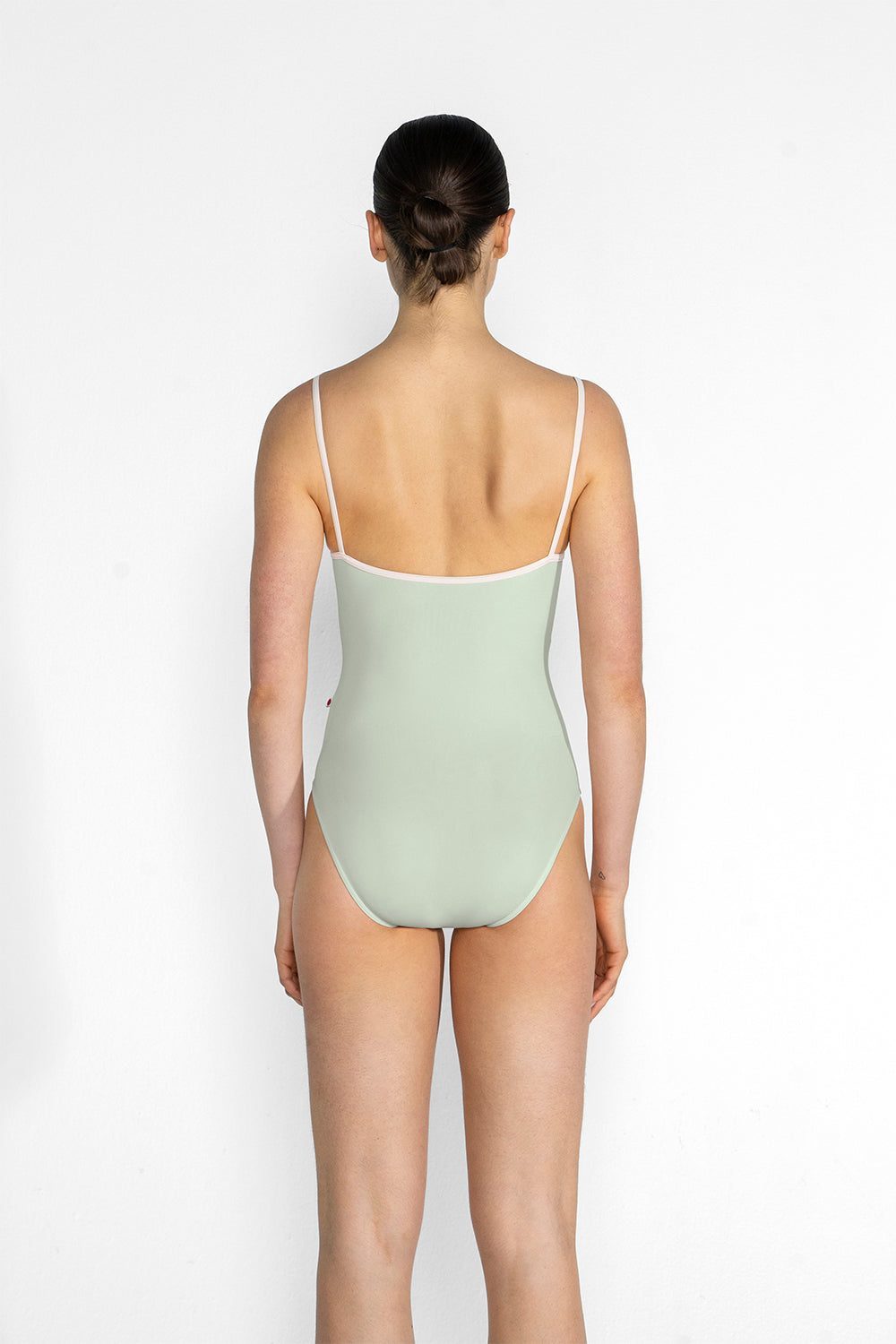 Kathy leotard in T-Pistachio body color, T-White trim color with Mesh Whisper overlay