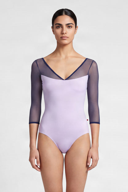 AI-generated model. Masha leotard, lilac with sheer navy mesh three-quarter sleeves and a navy-trimmed V-neck.