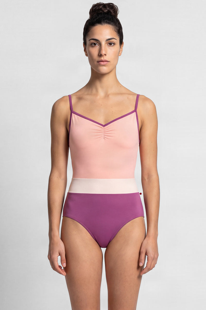 AI-generated model. Micah leotard, blush bodice and a magenta body with a pale-pink waistband, thin straps.